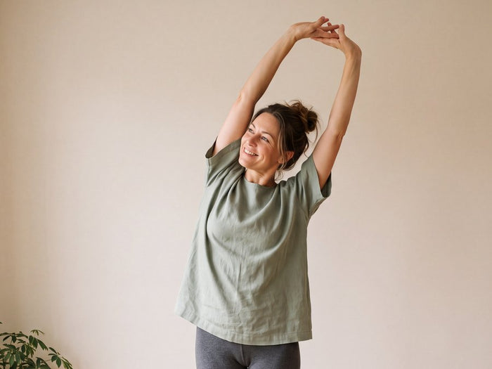 Woman stretching freely at home